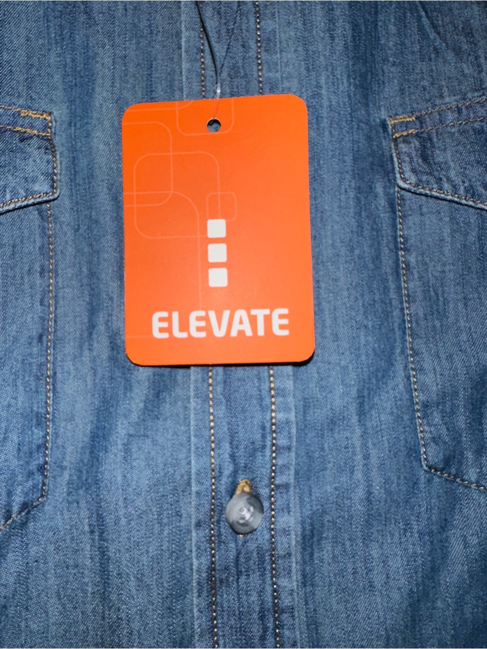 Elevate blue denim shirt with tag.